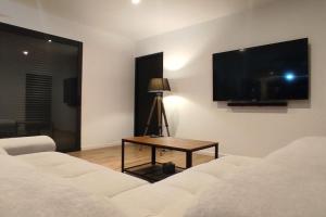 Ένα ή περισσότερα κρεβάτια σε δωμάτιο στο Le Refuge des Artistes