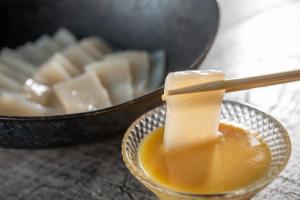 a bowl of honey and a bowl of cheese at KAMENOI HOTEL Kusatsu Yubatake in Kusatsu