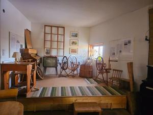 a living room with rocking chairs and a television at Ladan in Motala