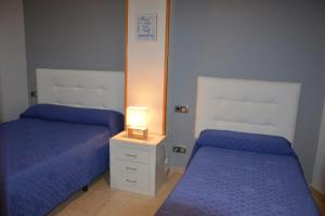 Postel nebo postele na pokoji v ubytování Hostal Mont Royal