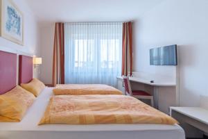Кровать или кровати в номере Apart Hotel Norden