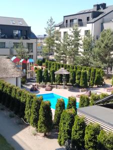 an image of a swimming pool at a resort at Vidmantės apartamentai in Palanga