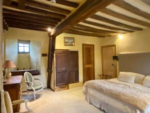 Llit o llits en una habitació de Château de Saint Paterne