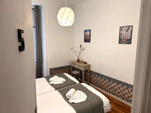 Postelja oz. postelje v sobi nastanitve 262 Baixa Guesthouse