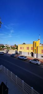 a group of cars parked on the side of a highway at SunDays House #casa al mare in Quartu SantʼElena
