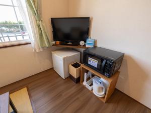 TV a/nebo společenská místnost v ubytování ひだまりinn