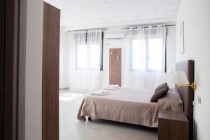 Postel nebo postele na pokoji v ubytování Pennaluce