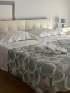 Postel nebo postele na pokoji v ubytování Hotel L'Approdo
