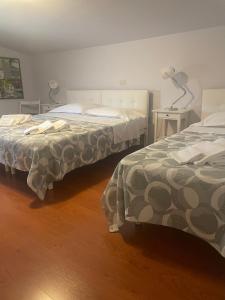 Postel nebo postele na pokoji v ubytování Hotel L'Approdo