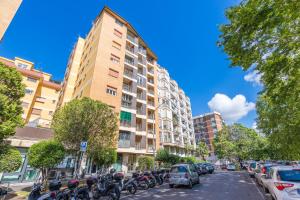 a row of motorcycles parked in front of a building at Lungotevere Apartment in Rome