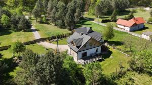 an aerial view of a house in a field at W Otulinie Czerwonej Góry in Chęciny +13 photos
