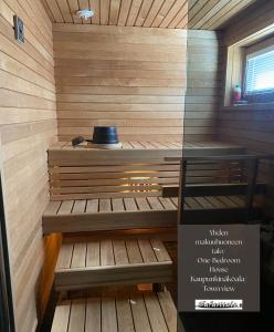 a sauna with a hat on top of it at Safaritalo Cottages in Kalajoki