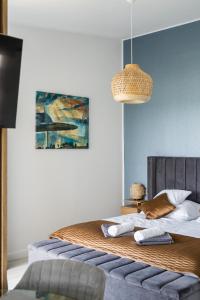 Posteľ alebo postele v izbe v ubytovaní Akvarell Apartmanház