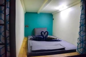 Ein Bett oder Betten in einem Zimmer der Unterkunft Lost & Found Zanzibar