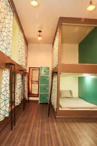 a room with two bunk beds in a house at Lost & Found Zanzibar in Zanzibar City