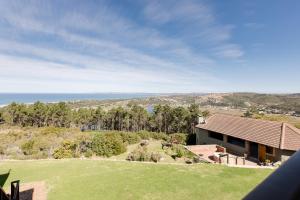 an image of a house with a view of the ocean at Garden Route Ilita Lodge in Great Brak River