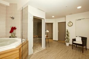 a bathroom with a large sink and a mirror at Residhome Arcachon Plazza in Arcachon