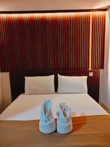Postel nebo postele na pokoji v ubytování Hotel Sri Sutra PJ 222