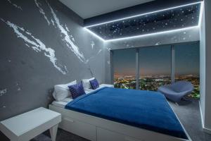 Postelja oz. postelje v sobi nastanitve Apartamenty w Sky Tower