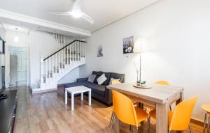 a living room with a table and a couch at 2 Bedroom Awesome Home In Elche in Elche