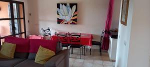 a living room with a couch and a table at HL 009- 2 Bedroom villa,HDA golf resort, Fuente Alamo in Murcia