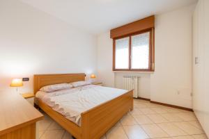 Postel nebo postele na pokoji v ubytování Andrei Flat - free parking & Verona