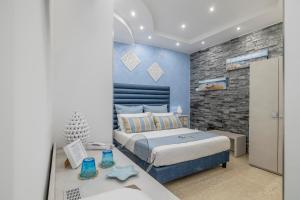 Postel nebo postele na pokoji v ubytování Hotel Soffio D'Estate