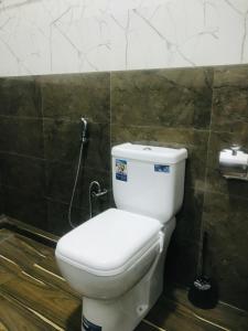 a bathroom with a white toilet in a room at Ananyah Villa in Trincomalee +20 photos
