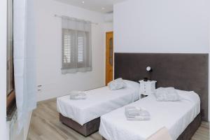 Letto o letti in una camera di Modianus Suite