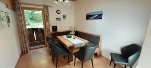 a dining room with a table and chairs at Haus Greiner in Nauders