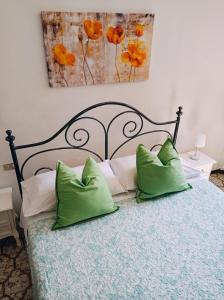 A bed or beds in a room at Affittacamere Chiti Melania
