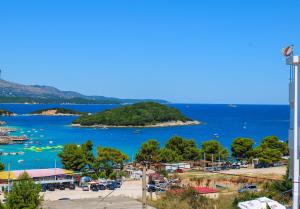 a view of a beach with boats in the water at Vila Erjoni in Ksamil