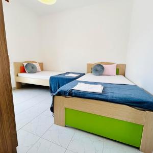 Postel nebo postele na pokoji v ubytování Central Complex Apartments , Delta Hospitality