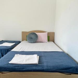 Ліжко або ліжка в номері Central Apartments Ariadni