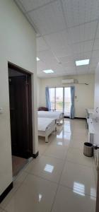 Voodi või voodid majutusasutuse Hello inn 哈囉行旅屏東館 toas
