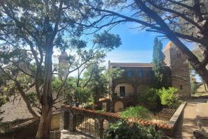 a view of a house with trees in the foreground at Ma Cabane in Collioure