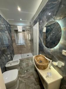 a bathroom with a sink and a toilet and a shower at That's Amore Accommodation Tropea in Tropea +65 photos