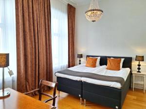 Postel nebo postele na pokoji v ubytování Hotell Linnéa - Helsingborg + 37 fotografií