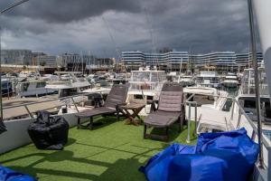 a group of boats are docked in a harbor at Boat ALOHA in Barcelona