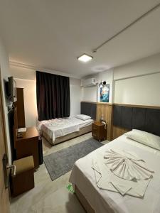 Voodi või voodid majutusasutuse Aristo 2 Butik Hotel toas