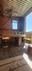 a kitchen with a table and chairs in a room at Ma Cabane in Collioure
