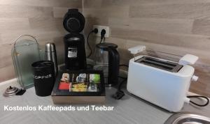 a kitchen counter with a coffee maker and a toaster at Ferienwohnung Katharina I in Alf