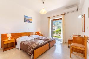 En eller flere senge i et værelse på Mires House Apartment 11