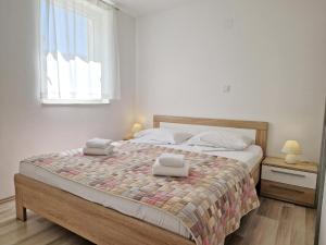 Ένα ή περισσότερα κρεβάτια σε δωμάτιο στο Apartment Slabek