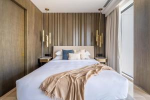 Postel nebo postele na pokoji v ubytování GuestReady - Majestic Oasis in The Palm Jumeirah