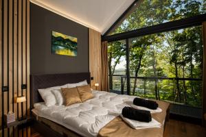Postel nebo postele na pokoji v ubytování DOG HILL Apartman