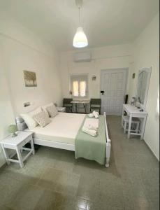 Postel nebo postele na pokoji v ubytování Garden Rooms