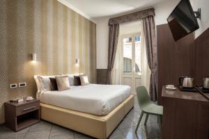 Postel nebo postele na pokoji v ubytování Hotel Ciao