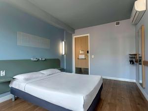 Кровать или кровати в номере ibis budget RJ Praia de Botafogo
