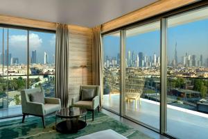 a hotel room with a view of the city at Hyatt Centric Jumeirah Dubai in Dubai